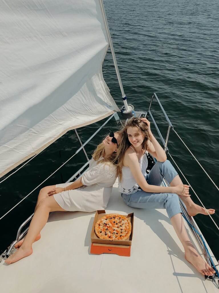 Beautiful Girls Sitting on the Yacht