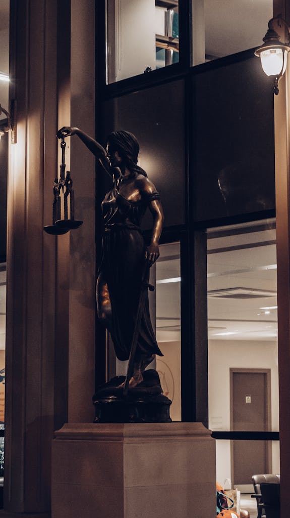 Bronze Lady Justice Statue in a Building